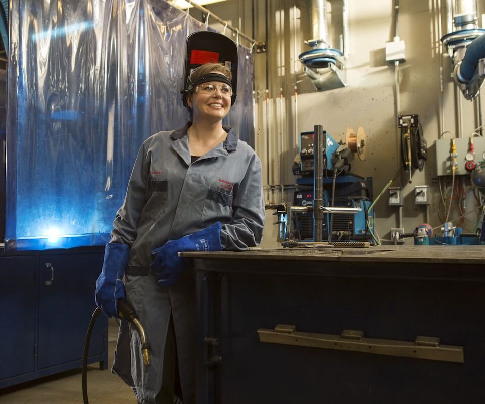 Women wearing welding gear in a welding lab