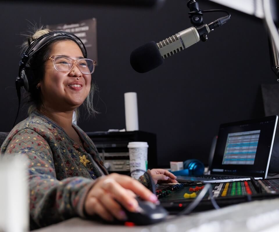 A student working in a broadcast booth