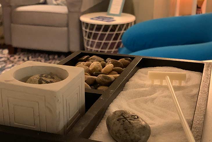 A small tabletop Zen garden with sand